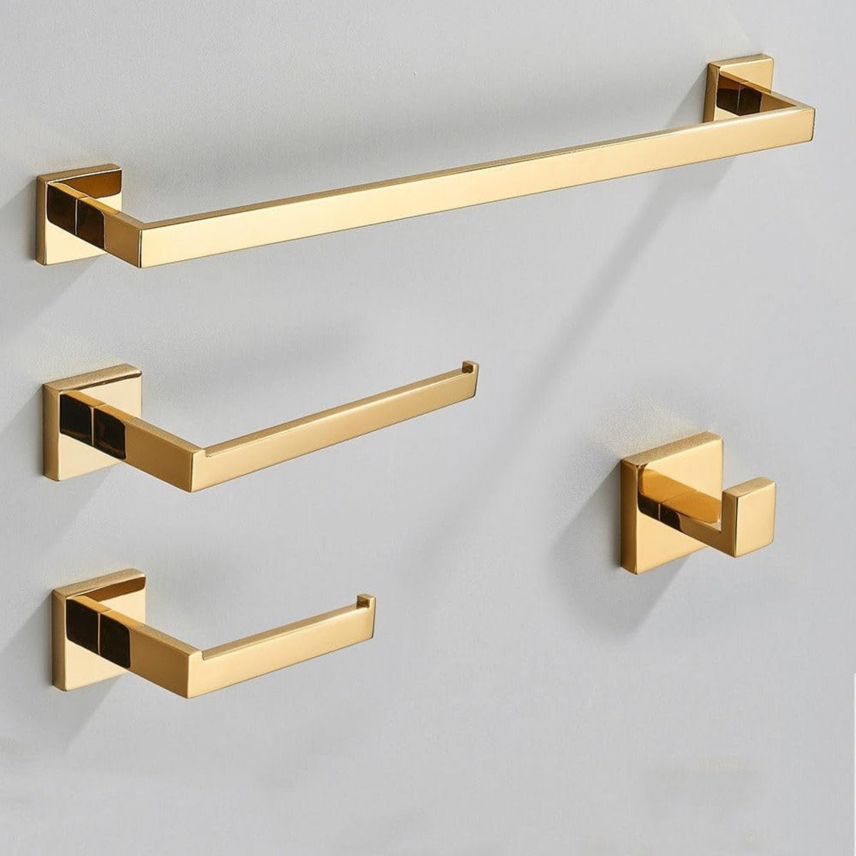 Kit de acessórios para banheiro em aço inox dourado da Homedeccori com toalheiros e porta-papel.
